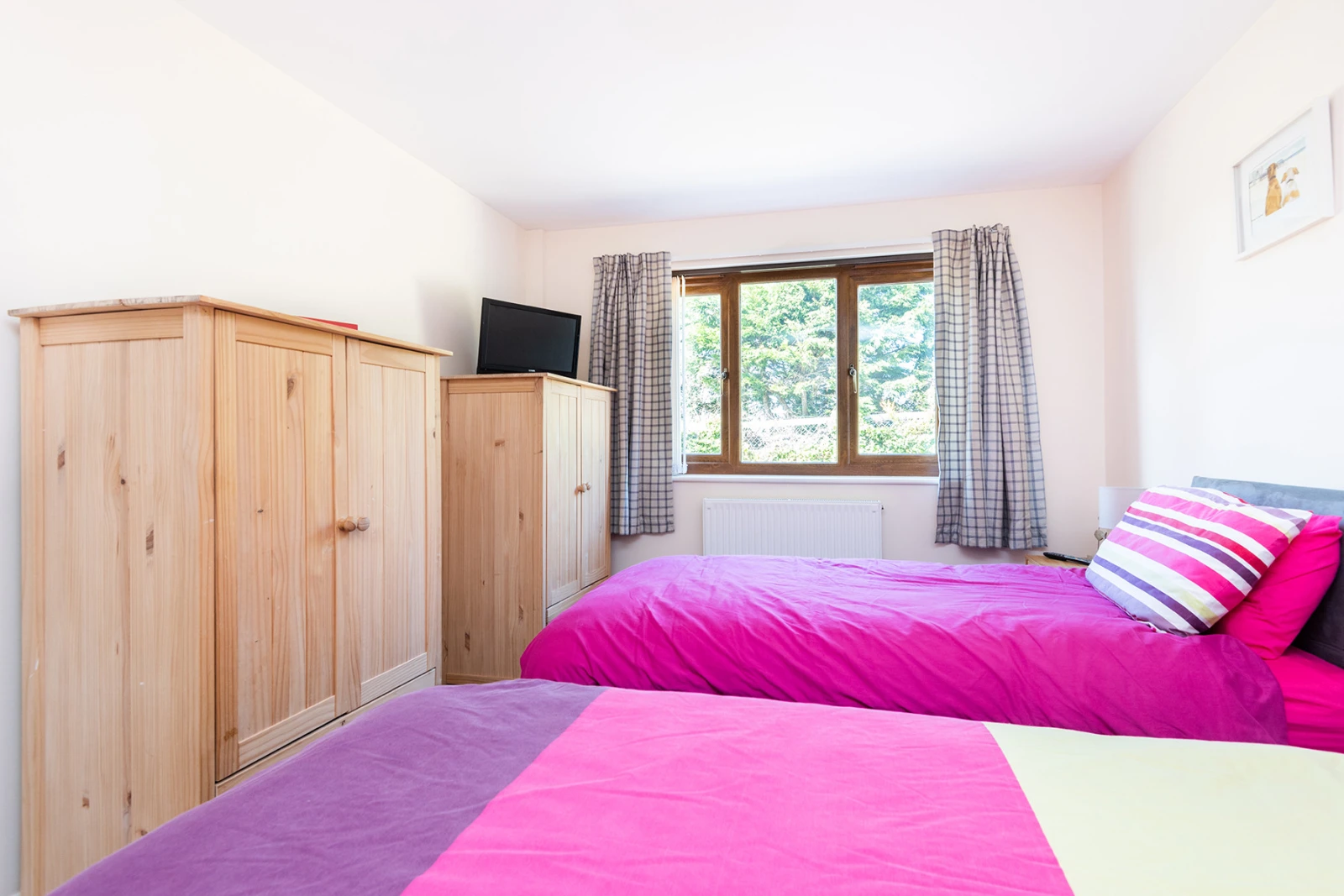 The twin bedroom with small TV