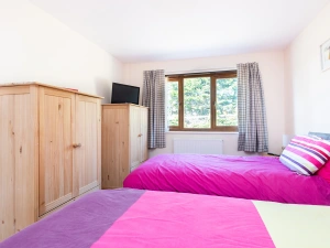 The twin bedroom with small TV