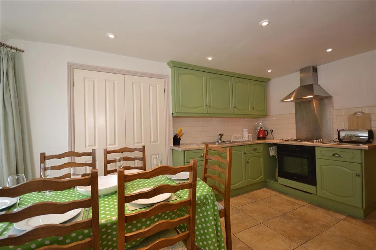 Another view of the kitchen and dining area