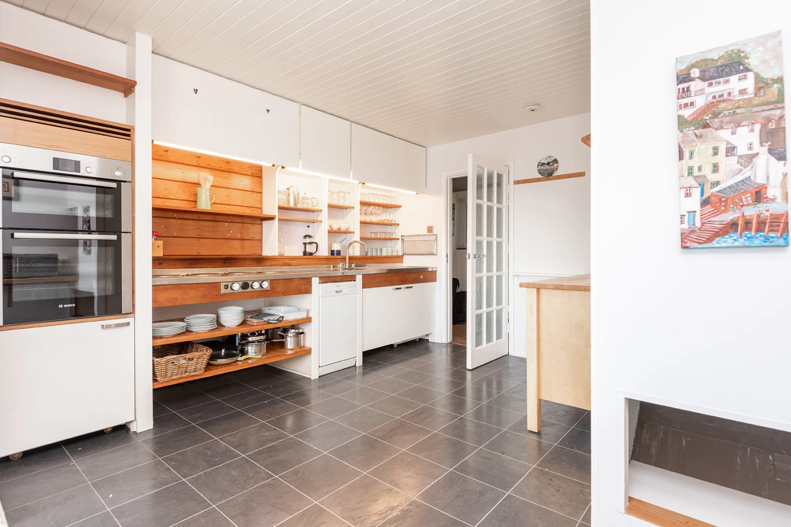 The retro kitchen with picture windows to watch the sea whilst you cook!