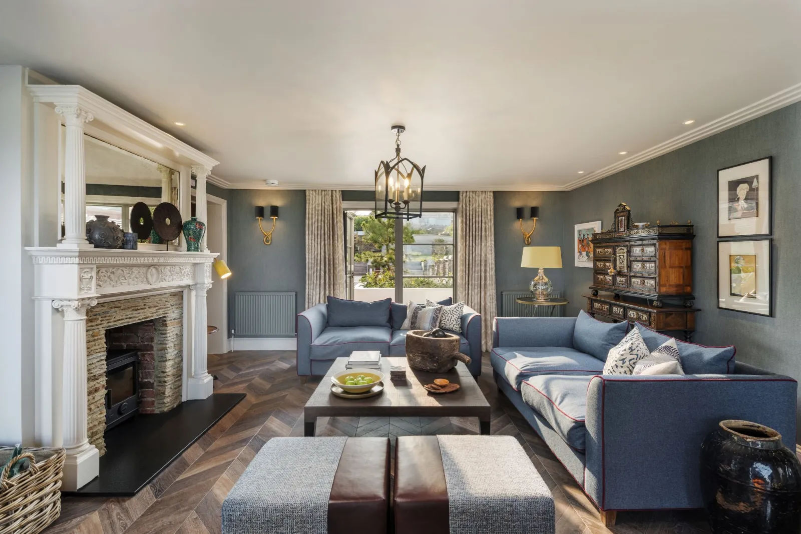 Living area with wood burner, sofas - Beam Ends