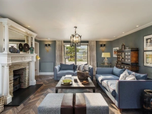 Living area with wood burner, sofas - Beam Ends