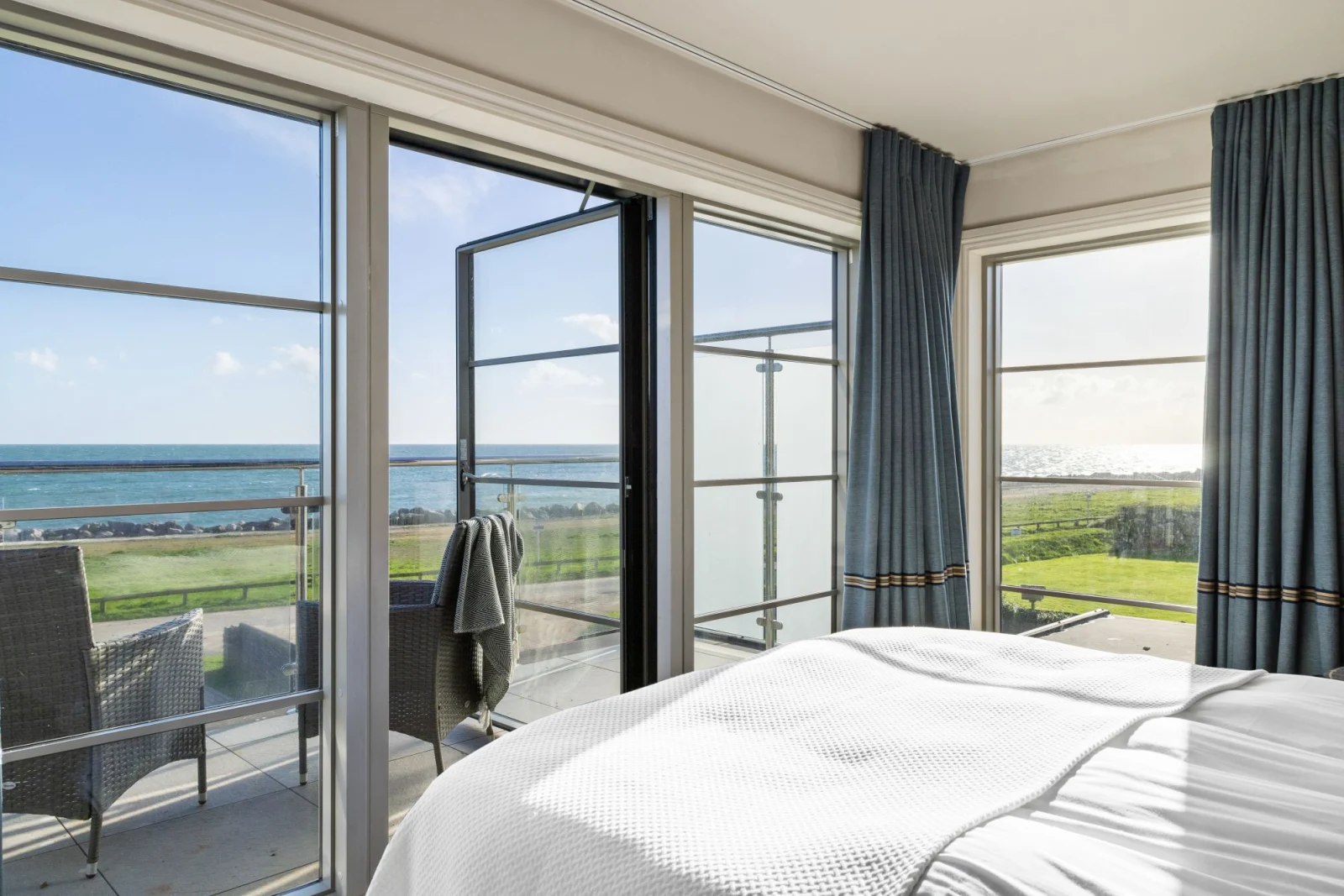 master bedroom with balcony access and sea view - Beam Ends