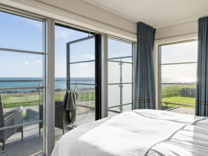 master bedroom with balcony access and sea view - Beam Ends