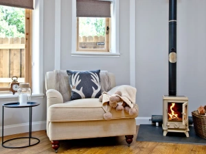 Comfortable chair with cosy fireplace - The Secret Roundhouse