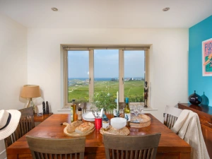Dining table with views over Newquay Golf Course - 5 The Vista