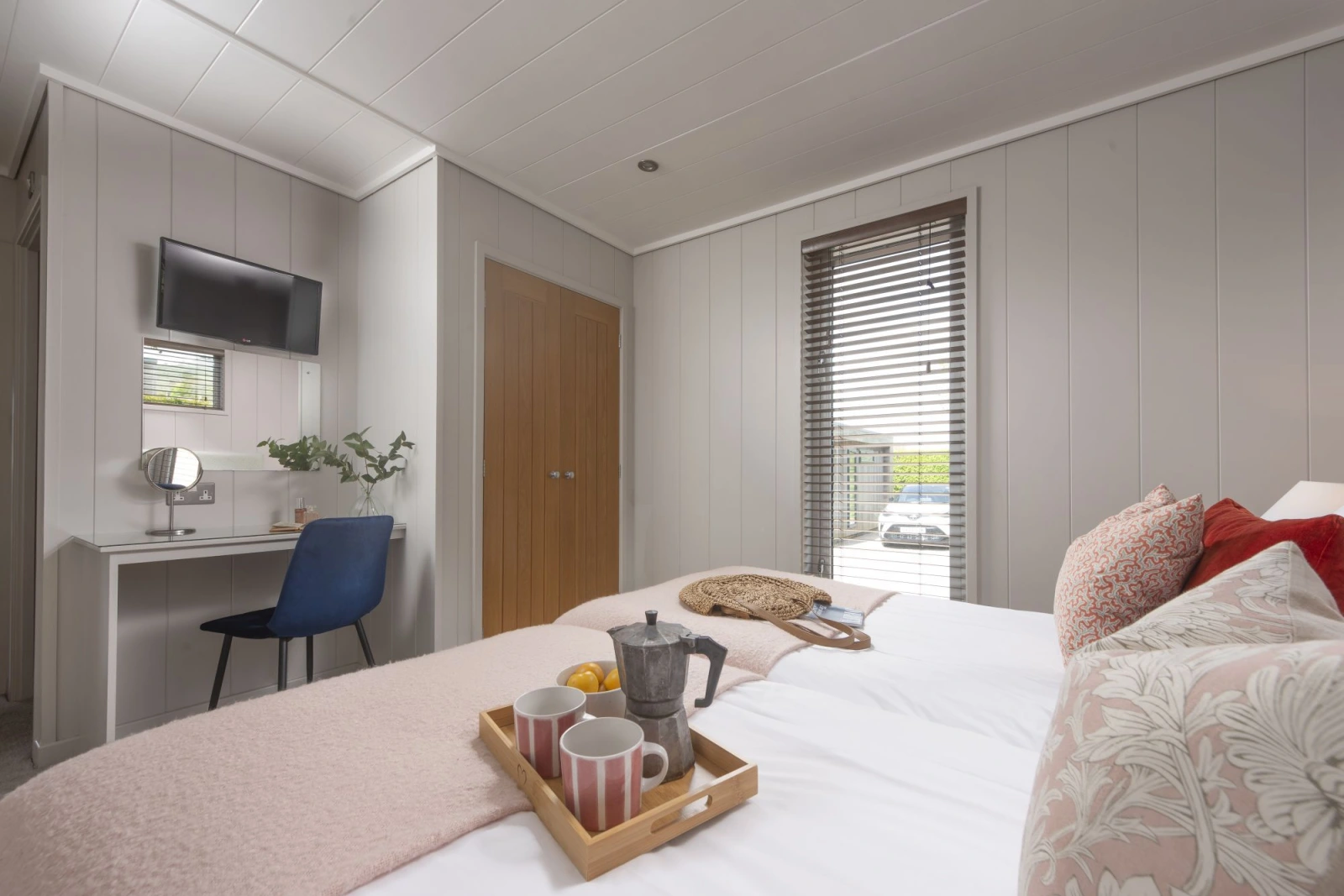 Bright and airy bedroom with wardrobe, TV  - Blackbird Lodge 