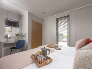 Bright and airy bedroom with wardrobe, TV  - Blackbird Lodge 