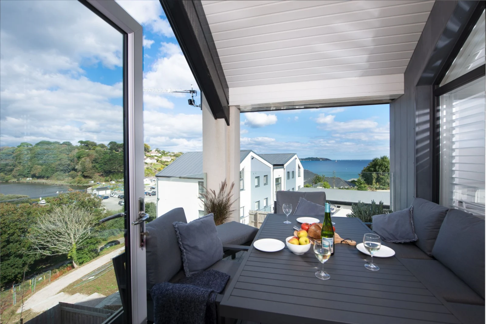 Outdoor dining area with ocean view on balcony  - Swanpool View