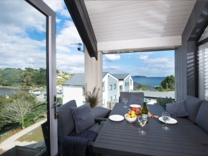 Outdoor dining area with ocean view on balcony  - Swanpool View