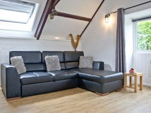 The sofa bed with seating for all guests - Anchor Cottage 