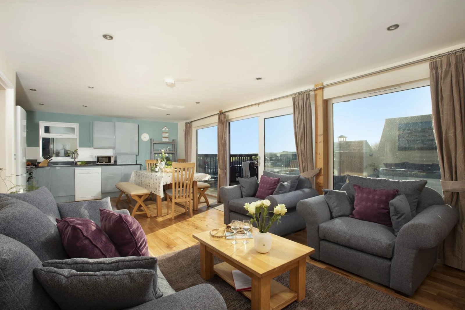 Open plan living area, sofa's, dining table and countryside view - Lodge 40, Retallack
