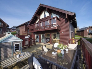 Front of lodge with outdoor seating and decking - Lodge 40, Retallack