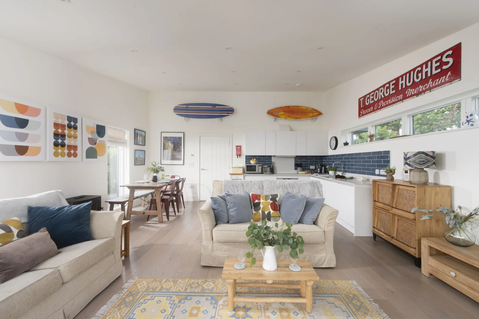 Lounge area leading onto the kitchen and dining area, open plan and bright and airy - 6 The Dunes, Upton Towans