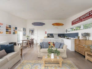 Lounge area leading onto the kitchen and dining area, open plan and bright and airy - 6 The Dunes, Upton Towans