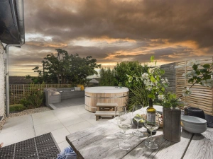 Dusk shot of the patio and hot tub - 6 The Dunes, Upton Towans