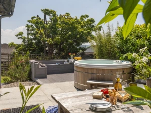 Patio area with hot tub and seating, outside dining table - 6 The Dunes, Upton Towans