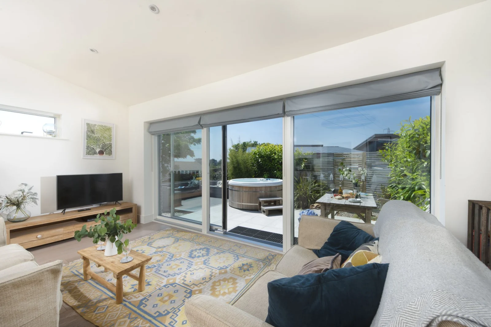 Sliding patio doors leading into the property, Smart TV with sofa seating for 4 guests - 6 The Dunes, Upton Towans