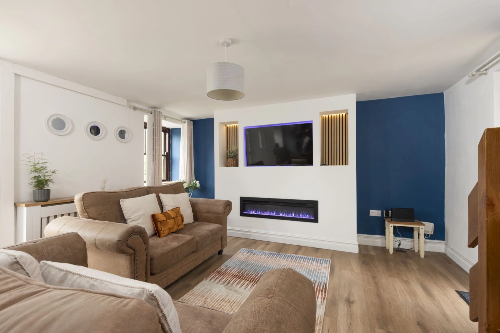Living space with Smart 50" LED TV and electric fire - The Old Hay Barn
