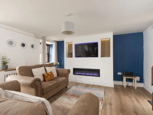 Living space with Smart 50" LED TV and electric fire - The Old Hay Barn