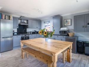 The kitchen with a dining table, fridge/freezer and oven - Lodge 27
