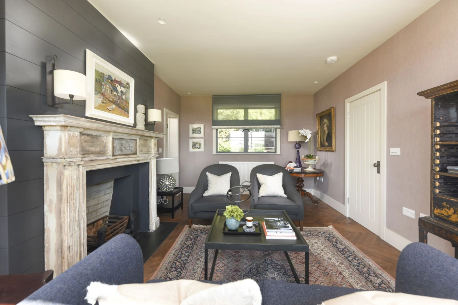 Seating for guests, fireplace and coffee table - Decoy Farm House