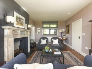 Seating for guests, fireplace and coffee table - Decoy Farm House