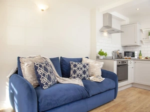 Living room and kitchen with washing machine and dryer - Cobblers Cottage