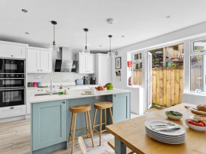 Open plan kitchen/dining room with island seating for two and access onto the back garden  - Bumble Cottage