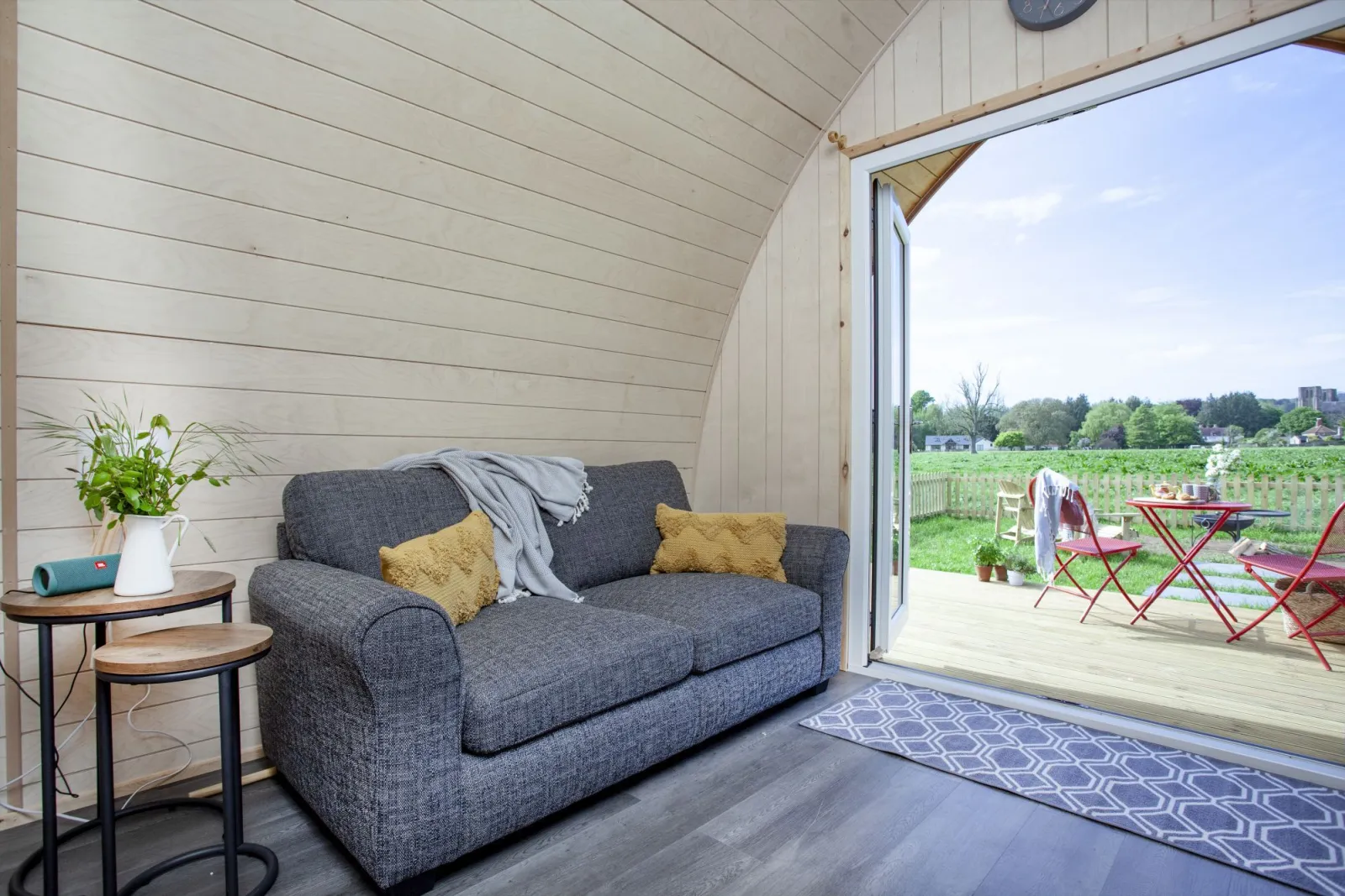 The sofa for guests to sink in and watch something or enjoy the views - Chapterhouse 
