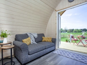 The sofa for guests to sink in and watch something or enjoy the views - Chapterhouse 