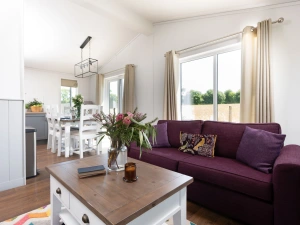 Comfortable sofa in the living area - Forget Me Not Lodge 