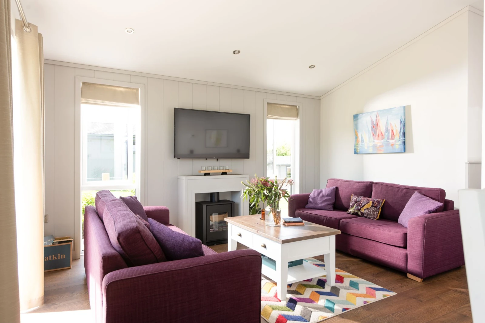 Seating for all guests with a coffee table and a Tv - Forget Me Not Lodge 