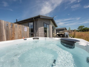 The hot tub for relaxing in no matter the weather - Forget Me Not Lodge 