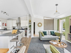 Open plan living area with access to kitchen and dining areas - Rose Lodge