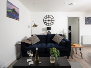 Comfy lounge with sofa, open plan with dining and kitchen area - Bay Dream