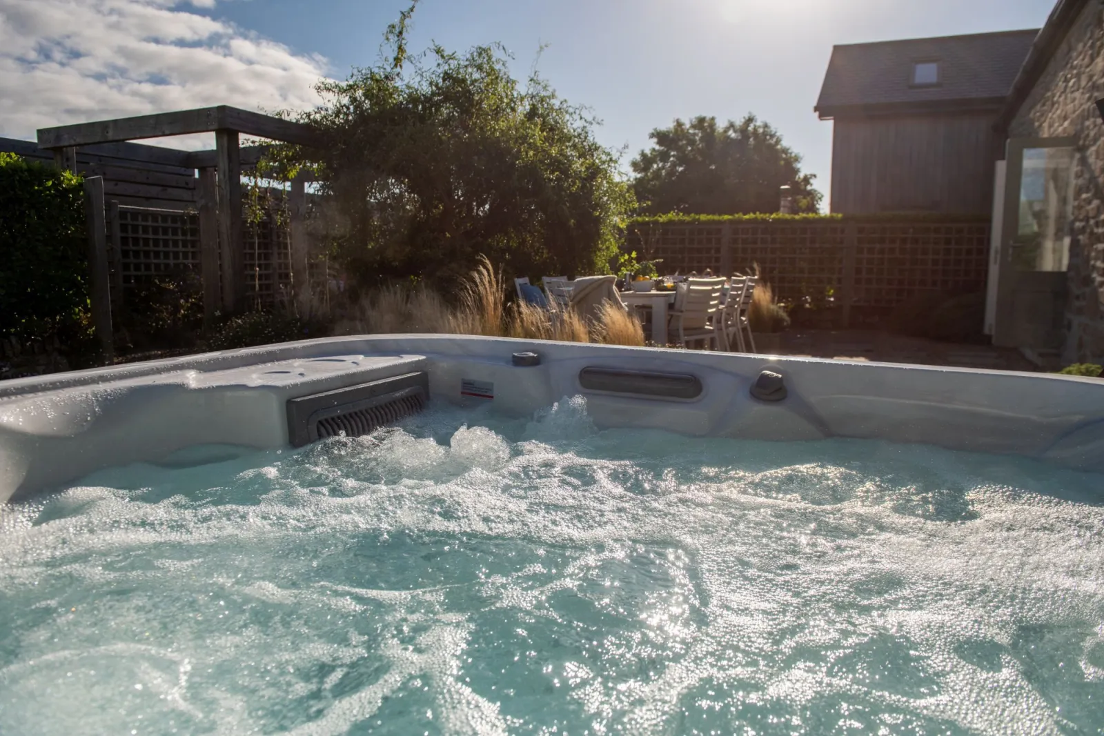 Relax in the private hot tub - The Haybarn
