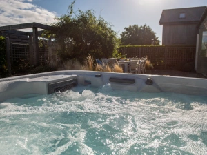 Relax in the private hot tub - The Haybarn