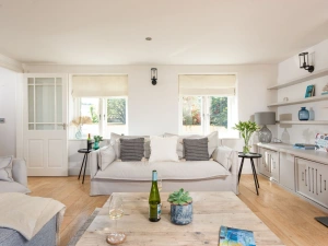 Bright and spacious lounge area, multiple sofas and a contemporary feel - The Haybarn