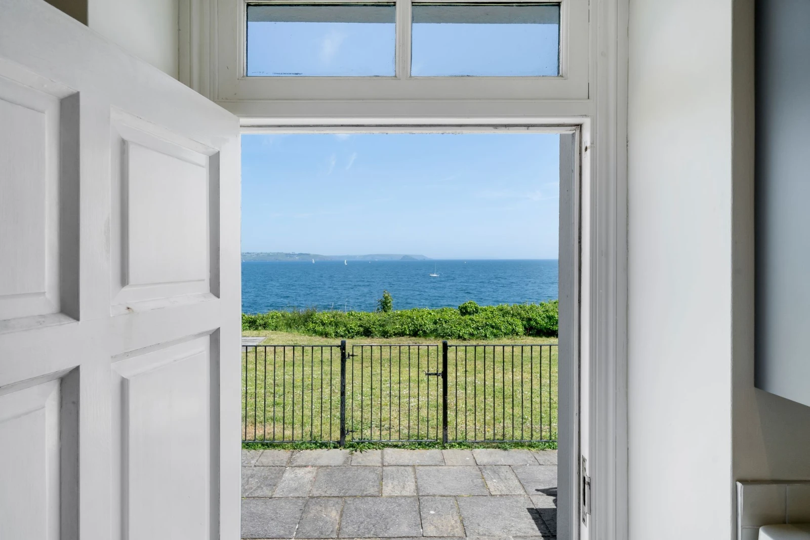Sea views from the kitchen, leading onto enclosed courtyard and grass area - 1 The Old Signal House, Penlee Point