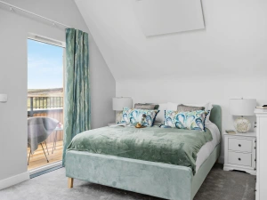 Bedroom 3 with king size bed, bedside tables and access to own balcony - 7 The Vista, Willingcott 