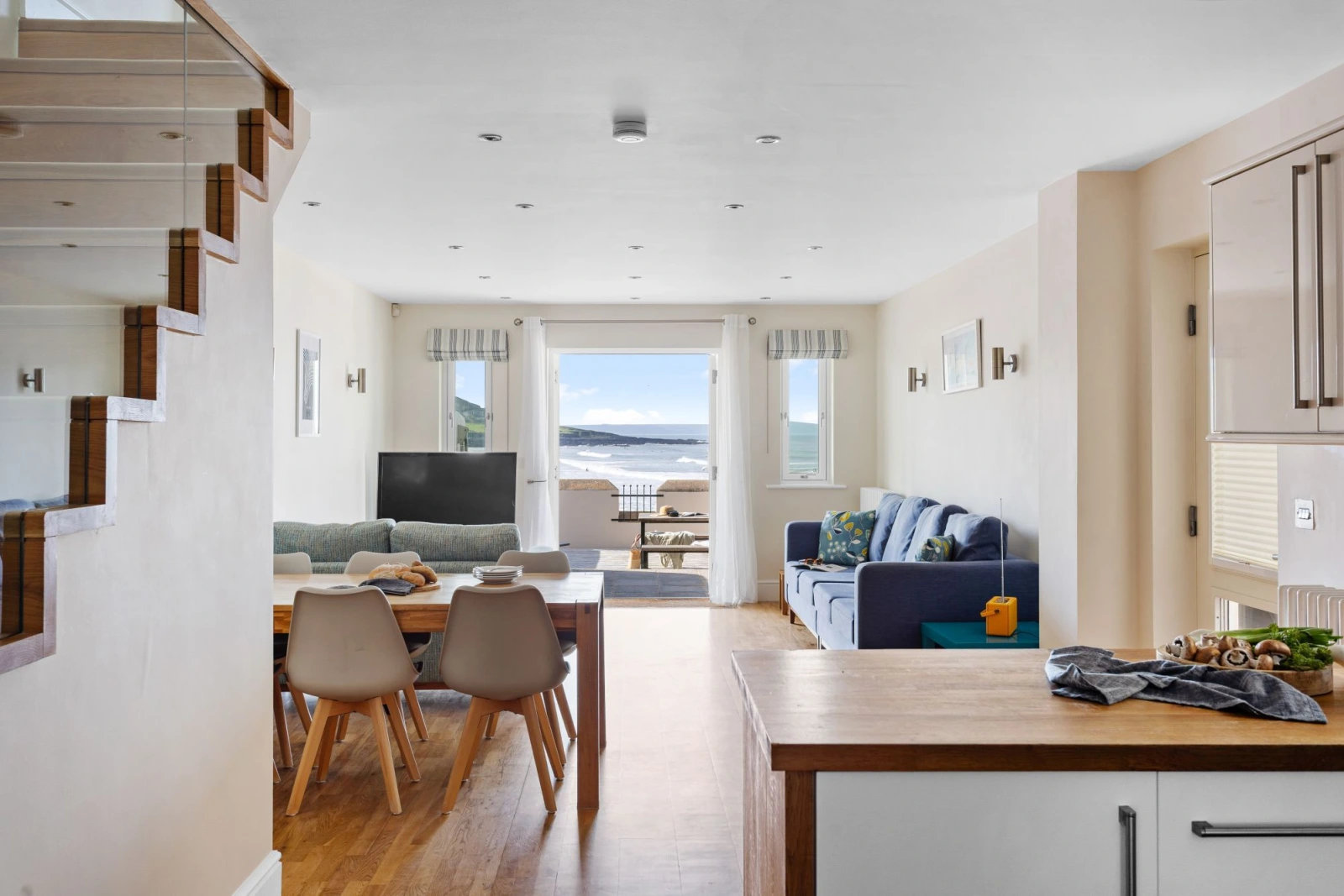 Open plan kitchen, dining and living space with first floor access - 4 Out Of The Blue