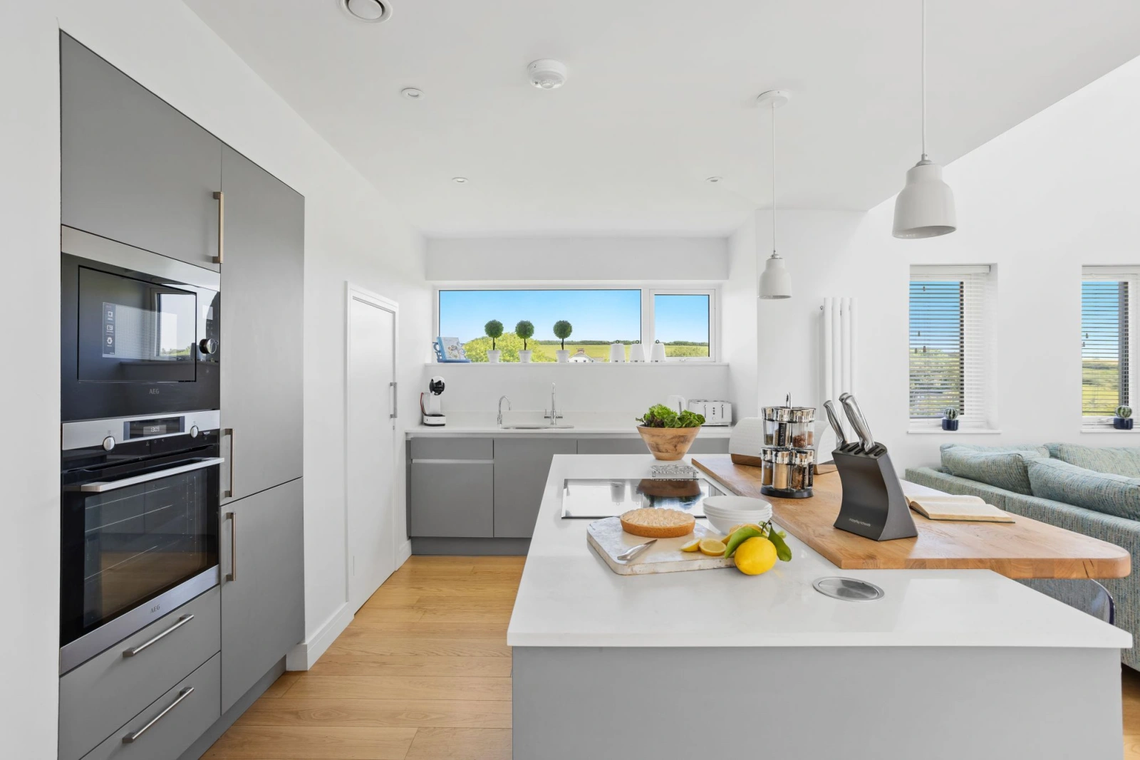 Lovely open kitchen with island and valley views from the window -  1 The Vista, Willingcott