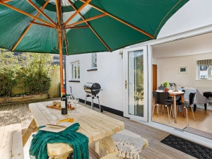 Furnished rear deck with parasol & charcoal BBQ - Vickery's Cottage