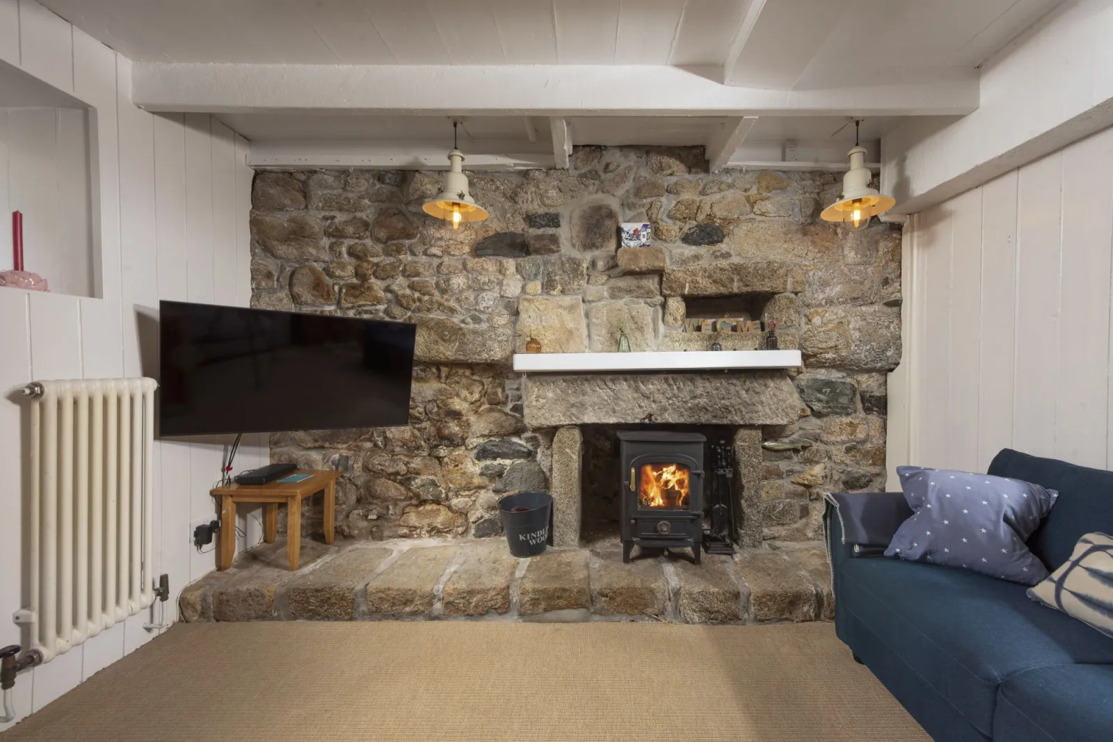 Cosy living room with woodburner - No.1 St Eia