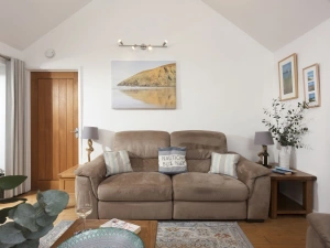 One of two sofas in the living area, with seating for 2/3 people - Samson Cottage