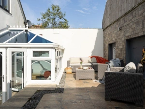 Rear garden with furnished patio - Midholm Chapel