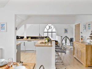 Kitchen and breakfast bar with original chapel windows - Midholm Chapel