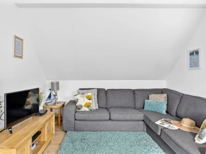 Living area with L shaped sofa, Smart Tv and free WiFi -  Midholm Chapel