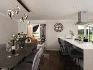 A lovely dining table to seat all guests and breakfast bar - Highfield Barton